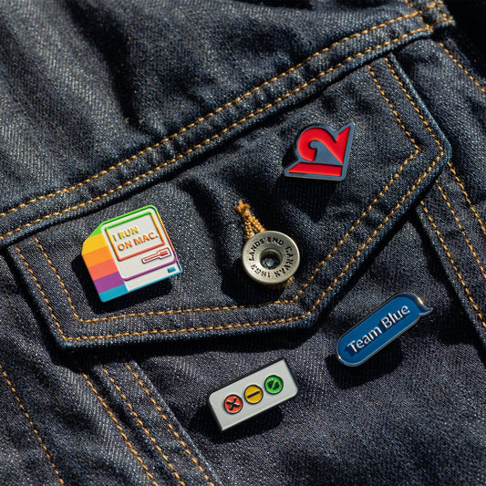 12s_Merch_MacPack_Pins_Lifestyle_02_HiRes