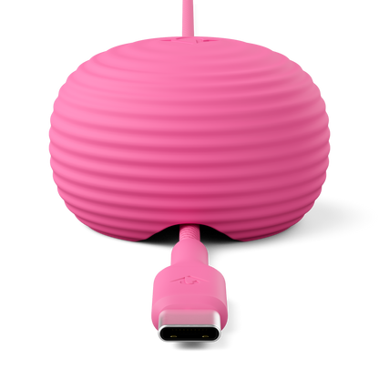 Pink silicone cable protector with USB-C connector on a white background