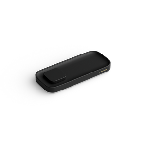 A sleek black rectangular charging valet with rounded corners and a small raised button on top, shown at an angle on a clean white background. The brand name  Twelve South is printed in small gold lettering on the right side.