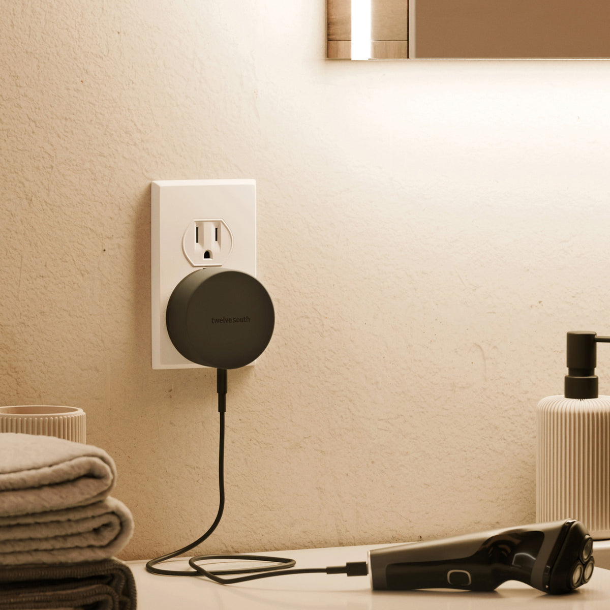 Smart plug on a wall with a device connected, in a bathroom setting.
