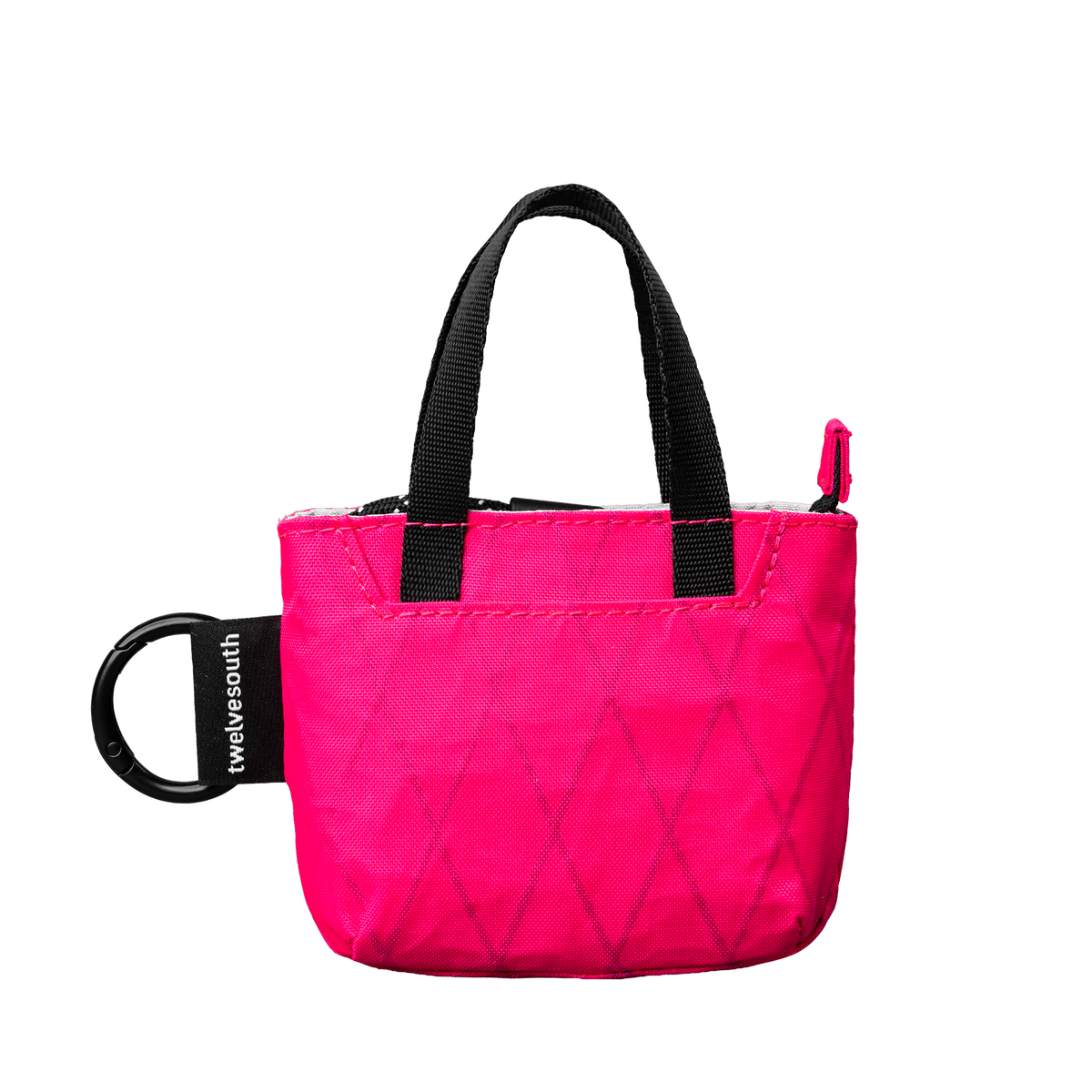 Pink micro tote with black handle on a white background
