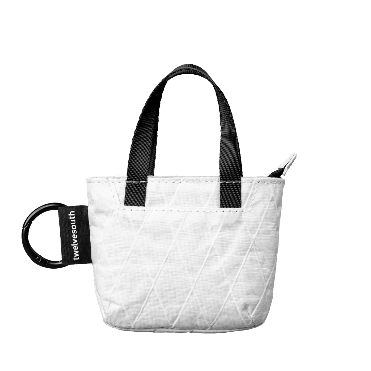 White quilted tote bag with black handles and a visible brand logo on a white background