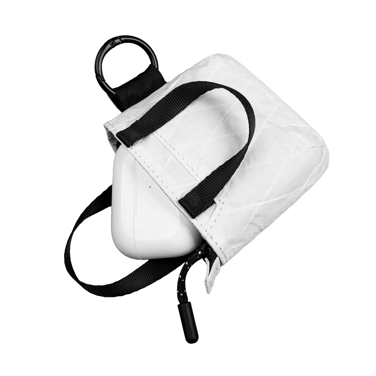 White tote with black strap on a white background and AirPods 