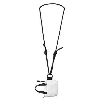 Small white pouch with a black strap on a white background