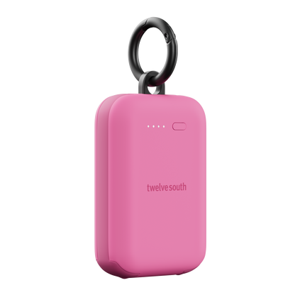 Pink portable device with a black ring on a white background