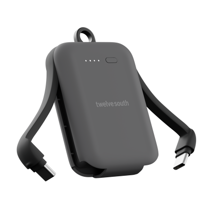 Portable battery pack with USB cables on a white background, featuring the Twelve South brand.