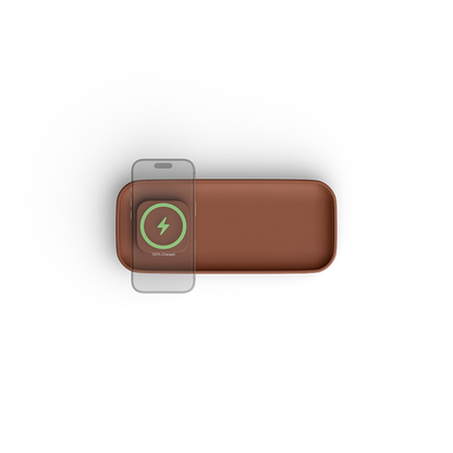 A brown rectangular wireless charging pad with rounded corners, shown from a top-down view on a white background. A smartphone is placed on top of the pad, with a green and white 'WARP CHARGE' logo visible on the pad's surface.