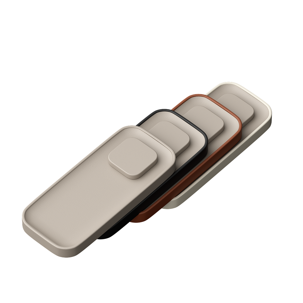 Full valet color range stacked diagonally on a white background. The cases come in ecru, black, brown, and taupe colorways.